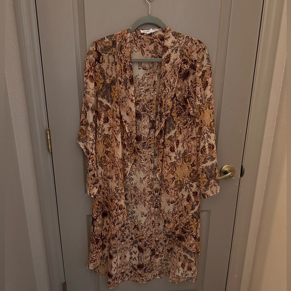 BCBG tunic pull over. Perfect to dress up any outfit